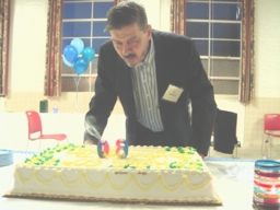 Joe blows out the candles on his birthday cake.