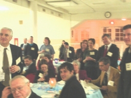 Partygoers listen attentively to Donna Bethell’s tribute.